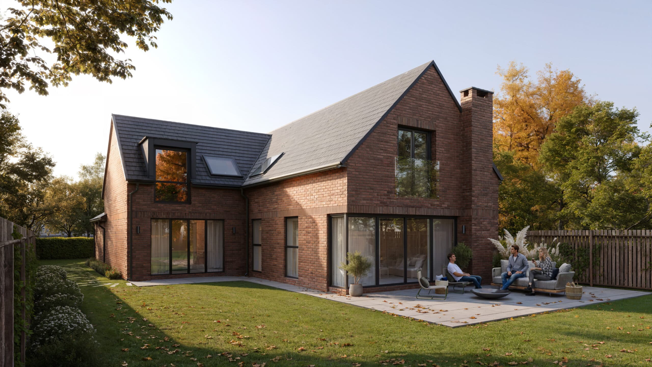 Rear of the house at golden hour, with a patio, sliding glass doors and a lawn